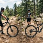 A side-by-side comparison of a 26-inch and 27.5-inch mountain bike on a dirt trail