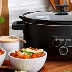 Electric multi-cooker preparing a healthy one-pot meal in the kitchen