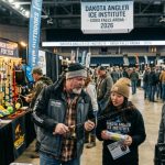 Anglers exploring fishing gear booths at the Dakota Angler Ice Institute show at Sioux Falls Arena in 2026